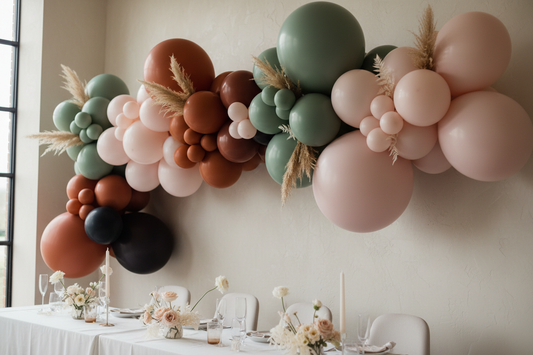 Matte balloon garland in warm neutral tones at an elegant event